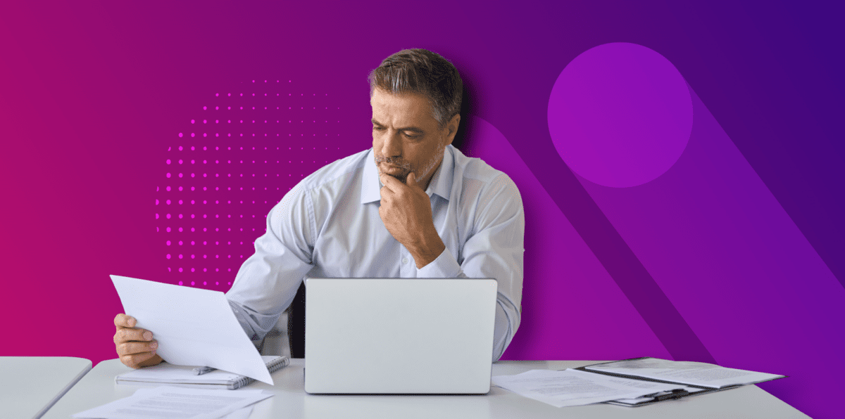 man on laptop with purple background doing inside sales
