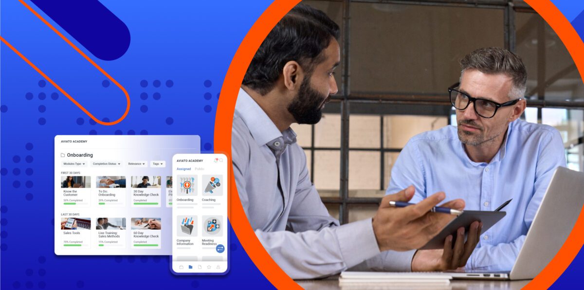 two men looking at a laptop with a revenue enablement platform product image from Mindtickle